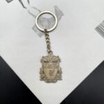 A bronze zinc alloy keychain with Liverpool logo.