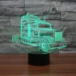3D LED night light Australia online with truck shape glowing in multiple colors on a desk.