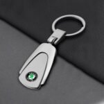 Skoda titanium keychain Australia online with car logo on a white background.
