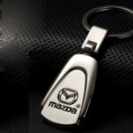 Silver Mazda titanium keyring Australia with car logo.