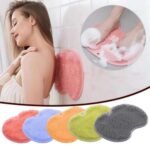 Blue exfoliating shower mat Australia with suction cups in a shower.