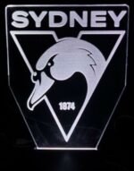 3D acrylic Sydney Swans night light glowing in red and white with the team logo.