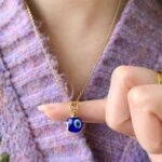 Australian evil eye necklace in gold with blue eye pendant.