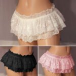 A black lace womens mini skirt briefs on a model.