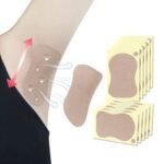 Nude-coloured Nikamey armpit sweat pad attached inside a white shirt.