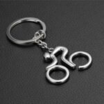 Silver sport bike keychain with metal bicycle design.