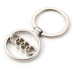 Silver Audi badge keyring Australia with logo pendant on a car key.
