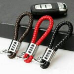 A black leather keychain with 3D Audi emblem.