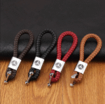 A shiny black PU leather keychain with a Mercedes Benz logo.