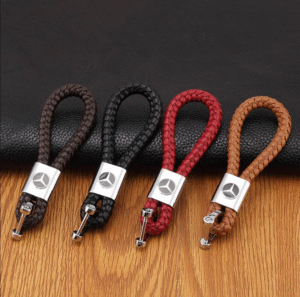 A shiny black PU leather keychain with a Mercedes Benz logo.