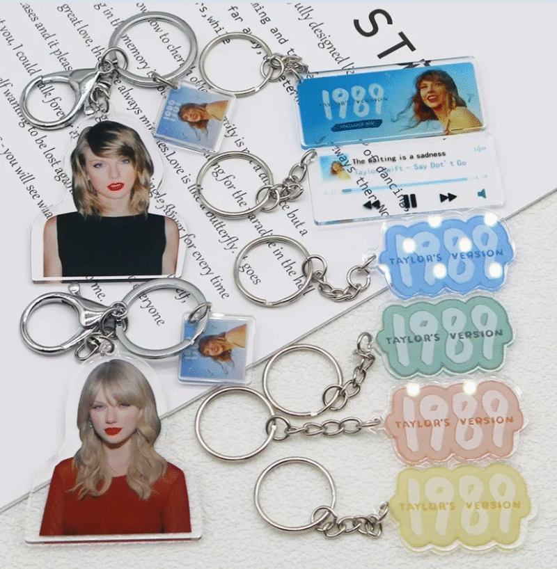 A multicoloured acrylic keychain with Taylor Swift 1989 design.