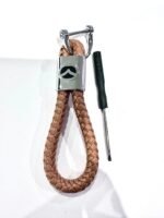 Black car styling metal leather keychain for Mazda Australia with Mazda logo on a car key.
