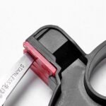Black 2-in-1 handheld knife sharpener Australia sharpening a kitchen knife.